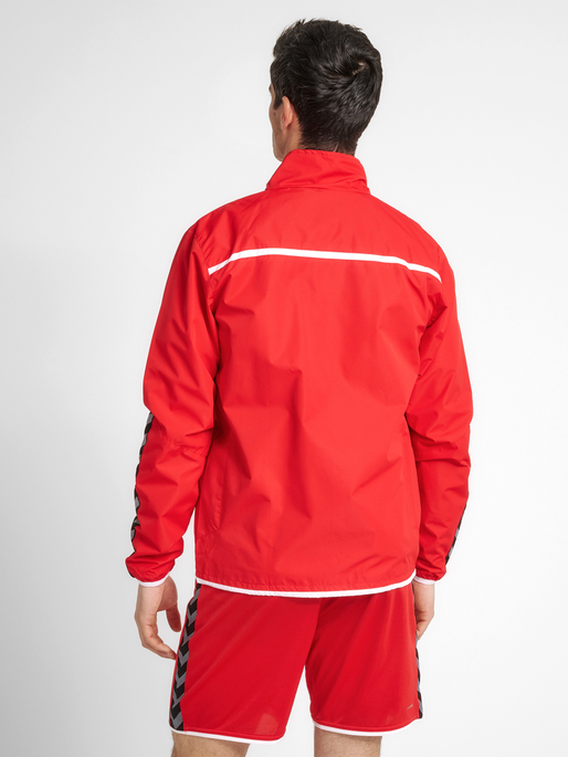 hmlAUTHENTIC TRAINING JACKET, TRUE RED, model