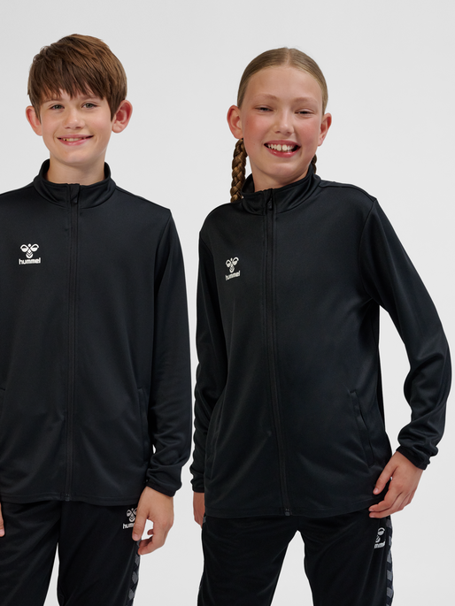 hmlESSENTIAL TRACK JACKET KIDS, BLACK, model