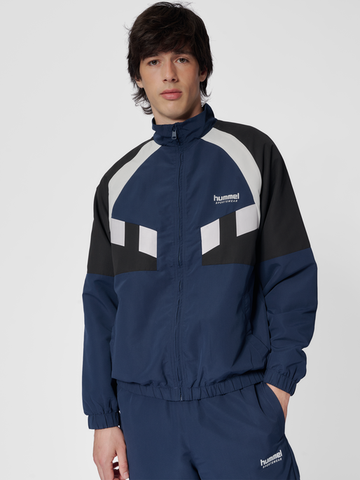 hmlTRACKSUIT JACKET SPORTSWEAR, DRESS BLUES, model