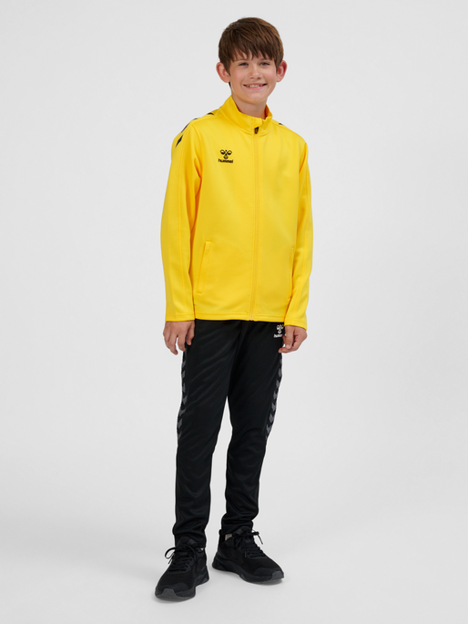hmlCORE XK POLY ZIP SWEAT KIDS, SPORTS YELLOW, model